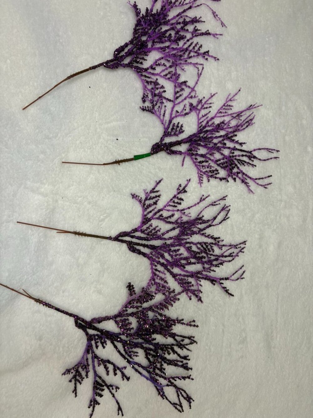 Set of four purple glitter plastic holiday picks